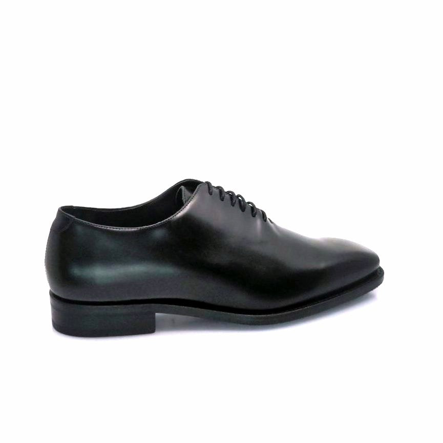 Black wholecut leather shoe for the left side for the shoes