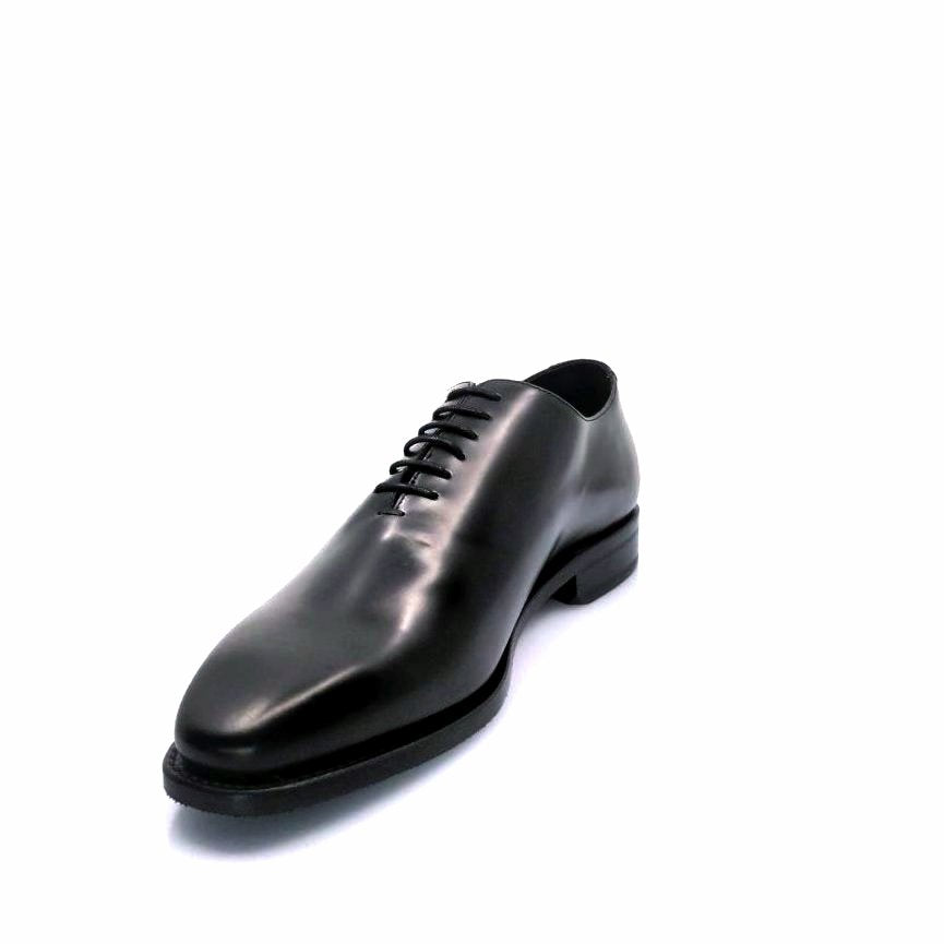 Black whole cut leather shoe for the right side view
